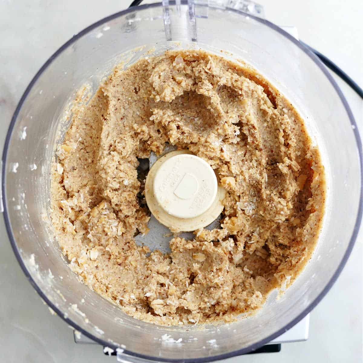 chickpea cookie dough batter blended in a food processor on a counter