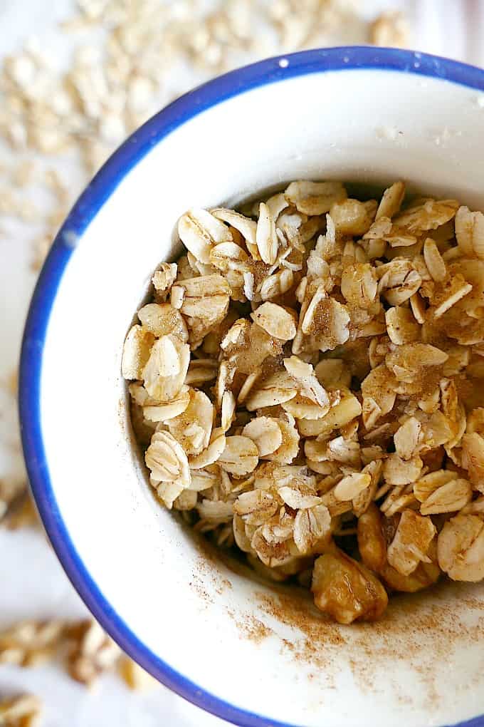 close up of Vegan and gluten-free single serve microwave apple crisp in a blue-rimmed mug