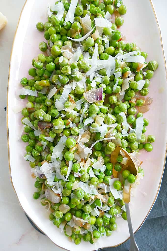 Parmesan Peas and Shallots on an oval serving dish