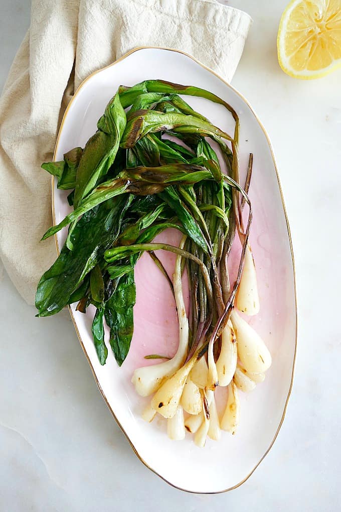 simple lemon grilled ramps on an oval serving platter