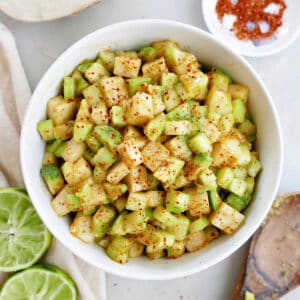 jicama cucumber salad in a bowl with chili lime seasoning