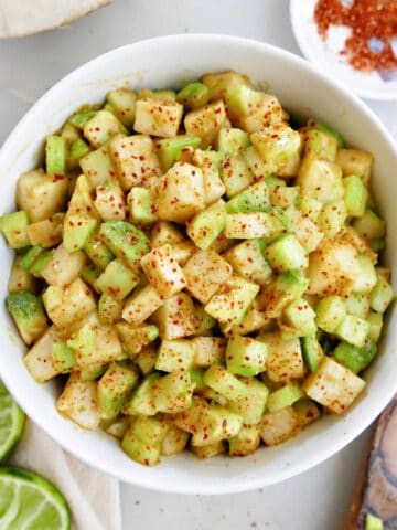 jicama cucumber salad in a bowl with chili lime seasoning