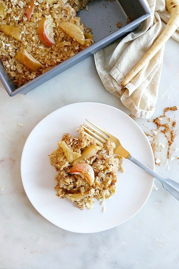 serving of parsnip and apple baked oatmeal on a white plate with a fork