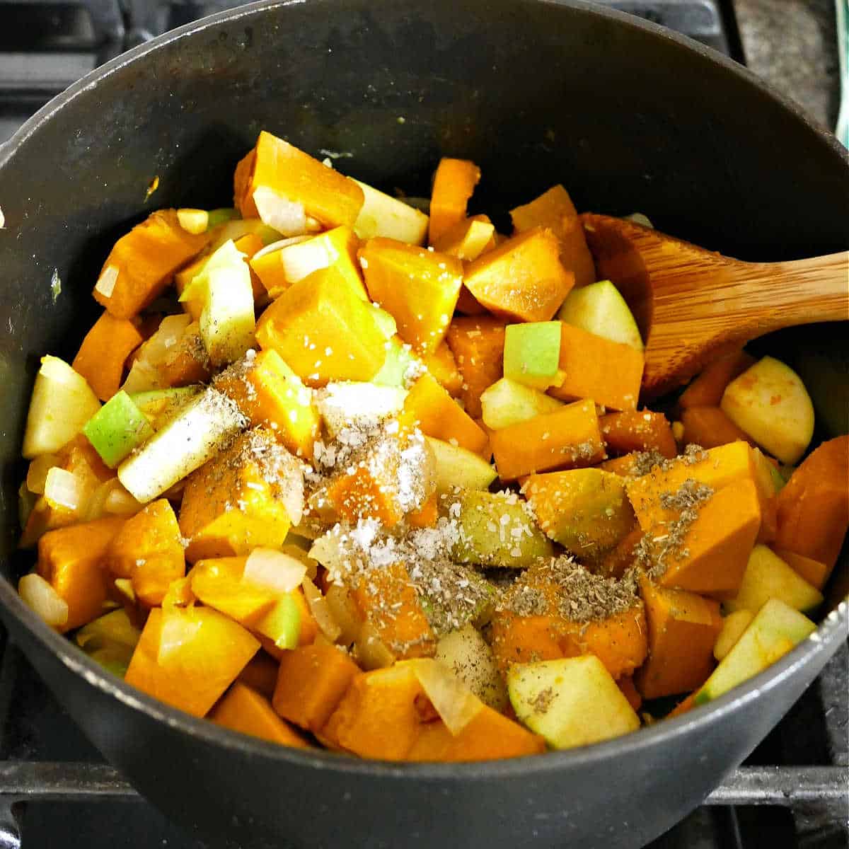 soup pot with ingredients for kabocha squash soup before adding the liquid