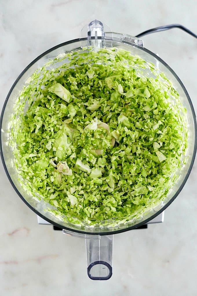 shredded brussels sprouts in a food processor