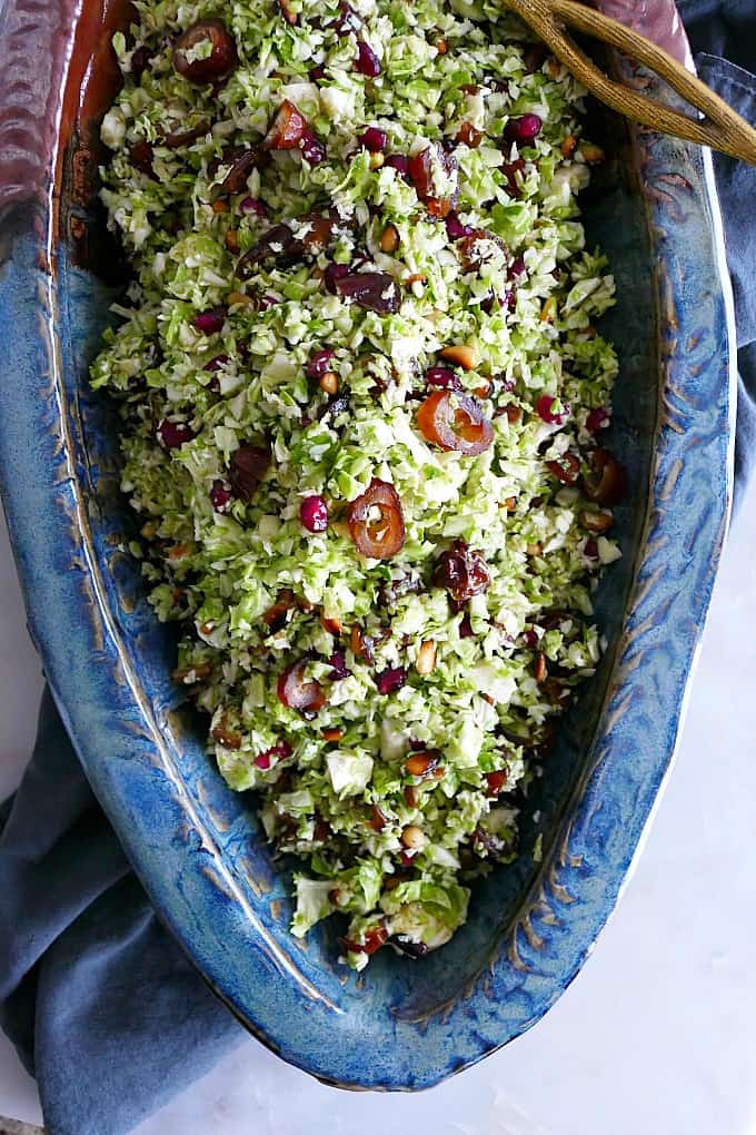 close-up image of Shredded Brussels Sprouts Salad in a large oval serving dish