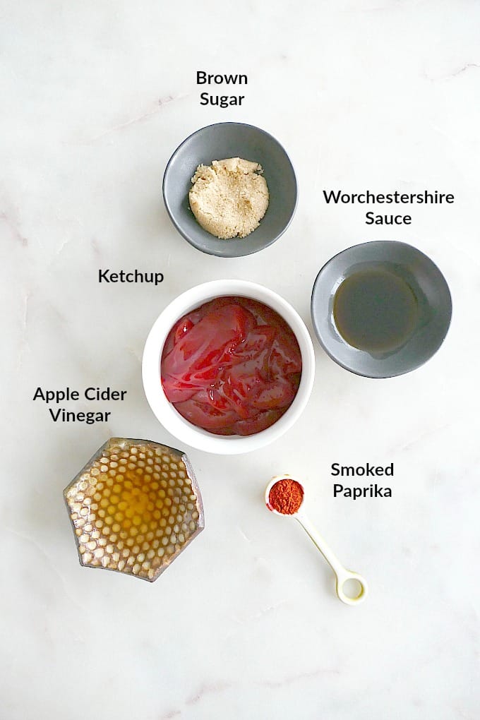 Ingredients for homemade barbecue sauce with text overlay on a white counter