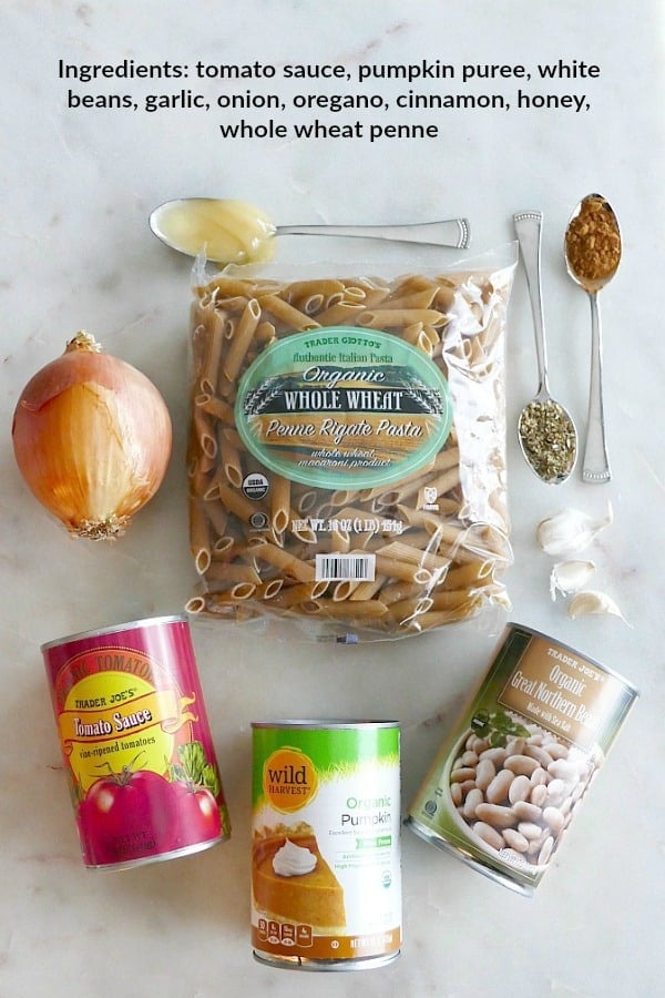 Ingredients for pumpkin tomato pasta with text overlay