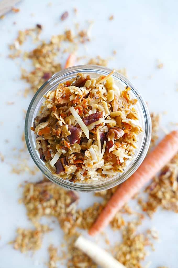 aerial view of a close up of carrot cake granola in a glass mason jar