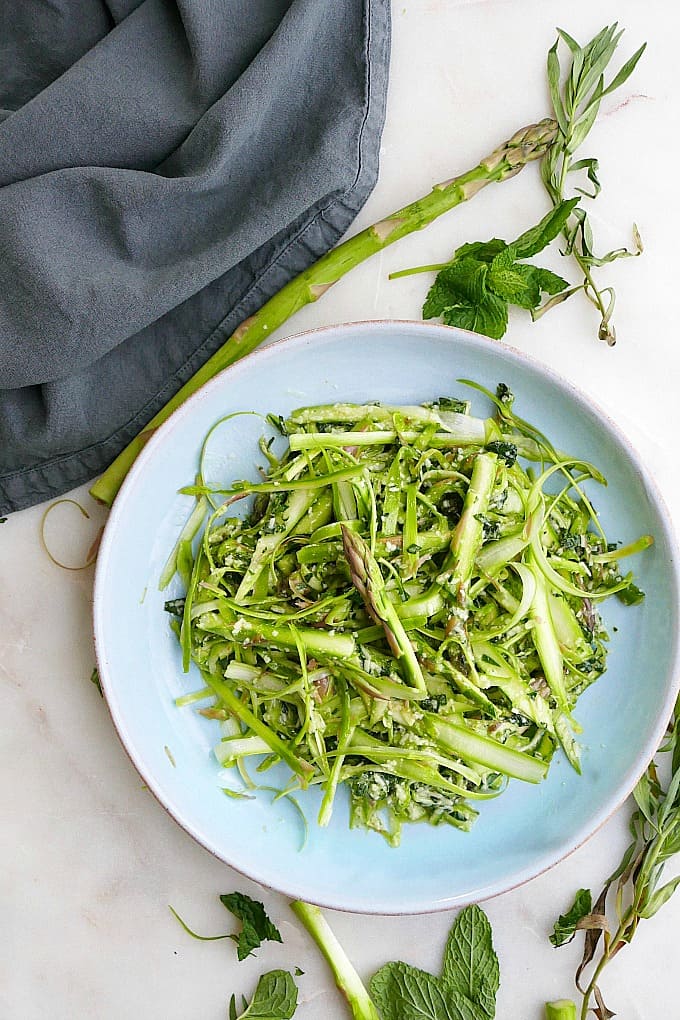 Shaved Asparagus Salad with herbs on a serving dish