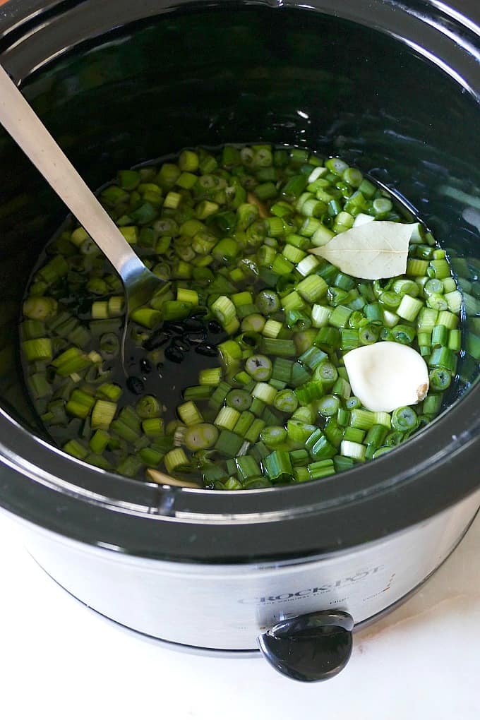 black beans and scallions in a slow cooker