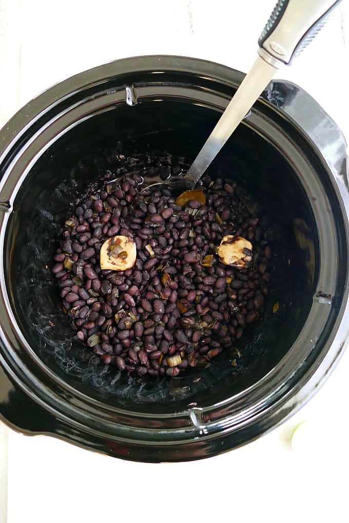 black beans and scallions in a slow cooker