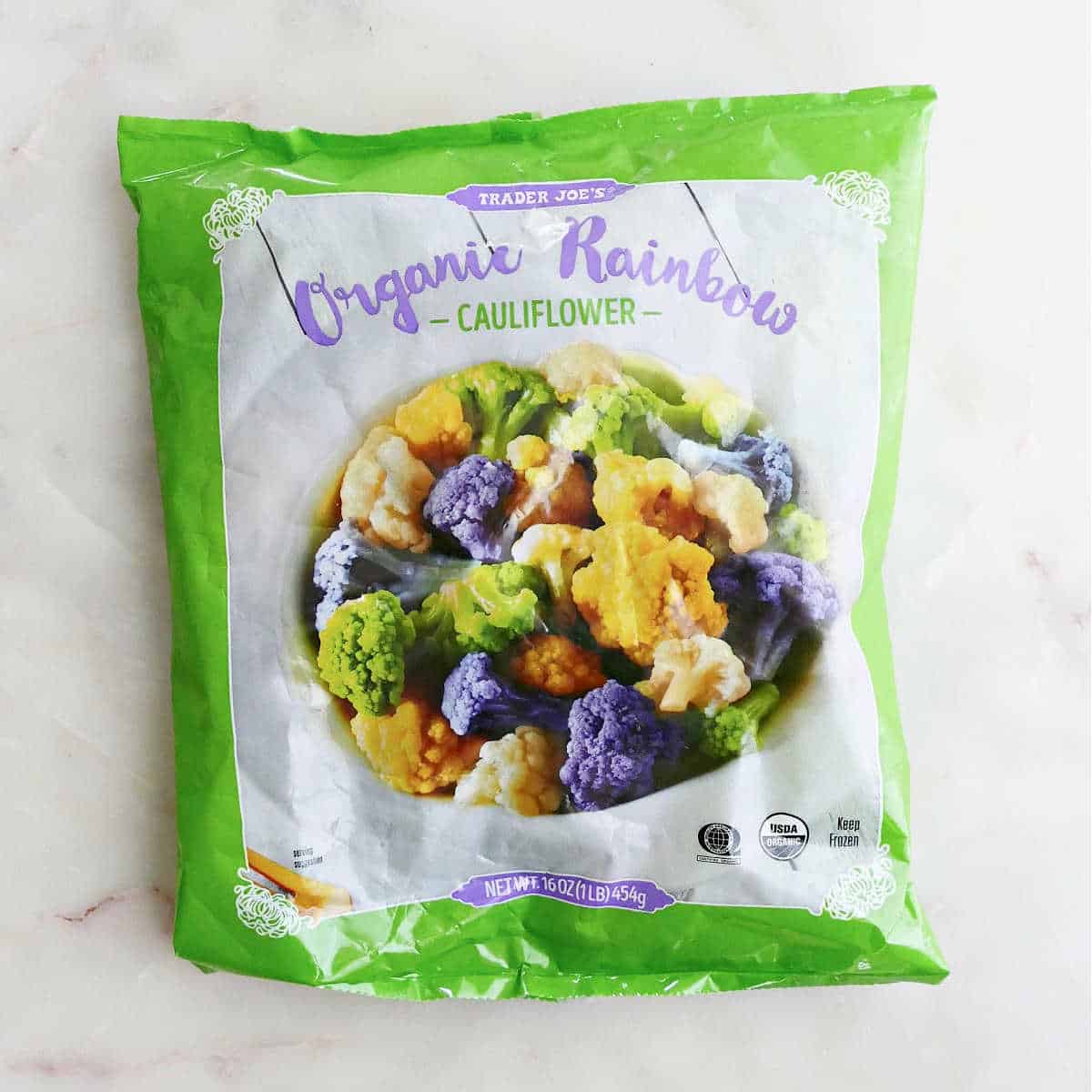 package of Trader joe's organic rainbow cauliflower on a counter