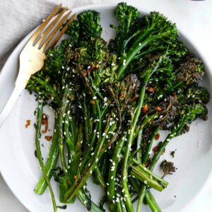 image of finished recipe on a plate with a fork on top of a counter