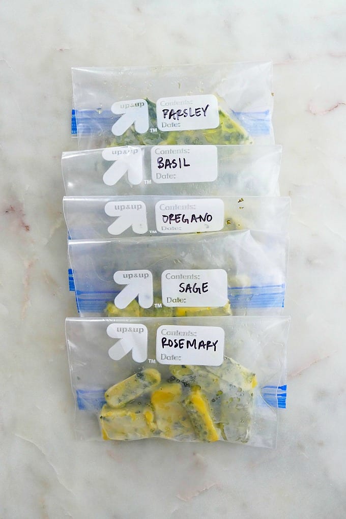 plastic bags with frozen herb cubes