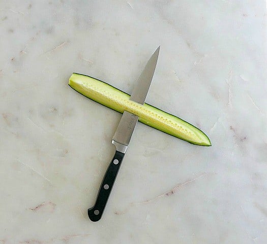 cucumber with a knife in it