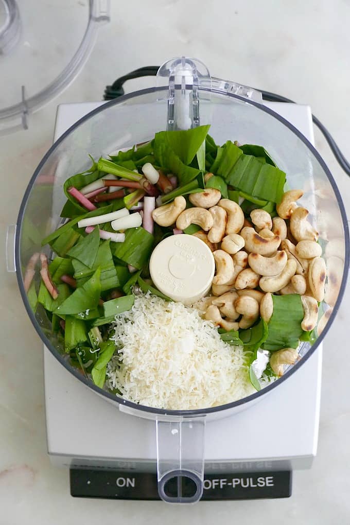 Ramps, toasted cashews, grated parmesan cheese, lemon juice, and olive oil in a food processor.