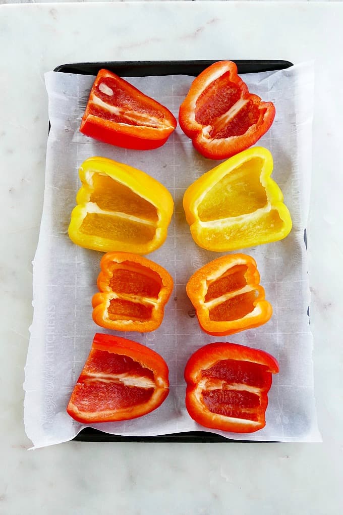 sliced peppers on a sheet pan