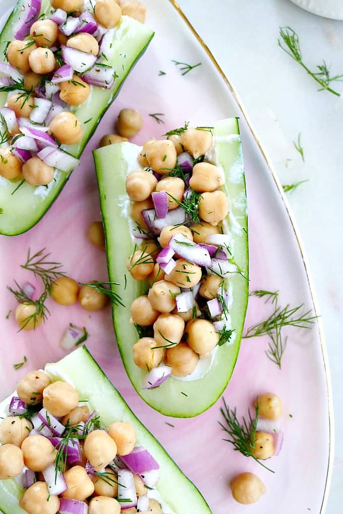 chickpea salad cucumber boats on a serving tray
