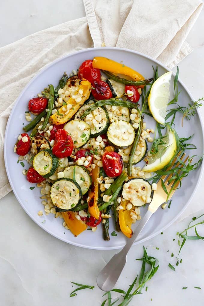 roasted summer vegetables with tarragon on a serving plate