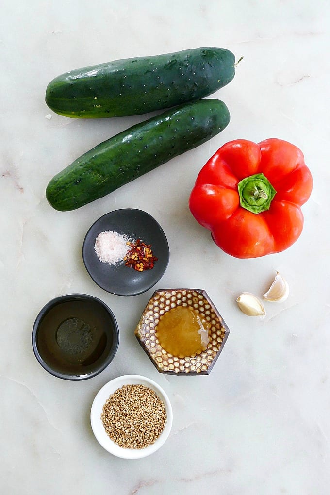 cucumber noodle salad ingredients spread out on a counter next to each other