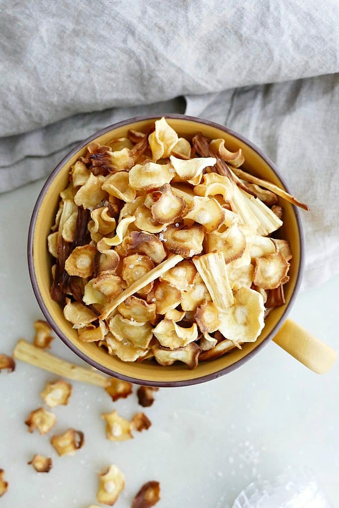 baked parsnip chips in mug