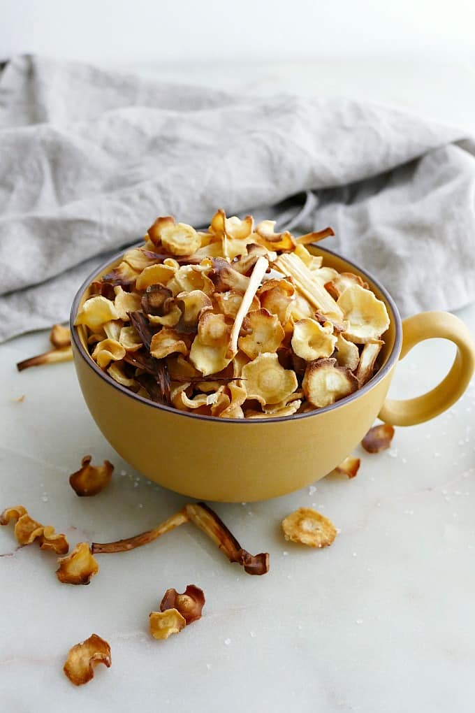 baked parsnip chips in mug