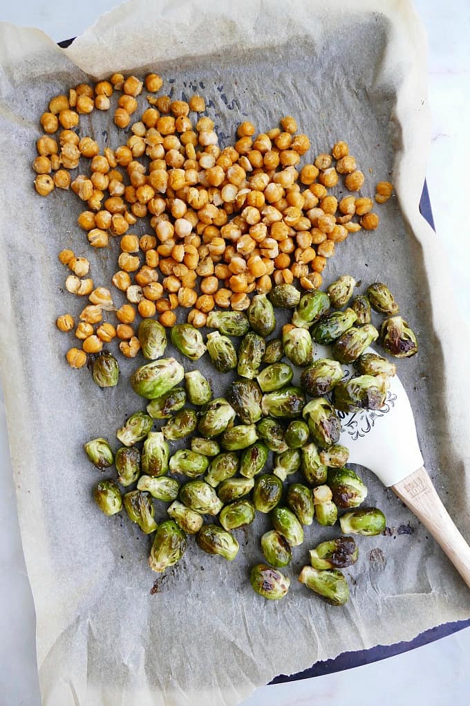 brussels and chickpeas on a baking sheet