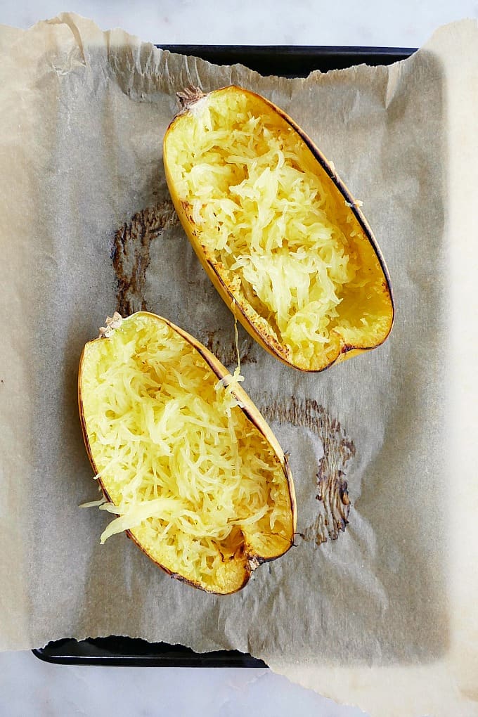 spaghetti squash on a baking sheet