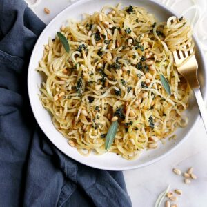 kohlrabi noodles and pine nuts in a bowl