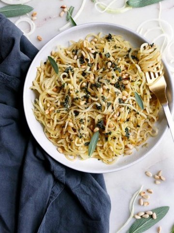 kohlrabi noodles and pine nuts in a bowl