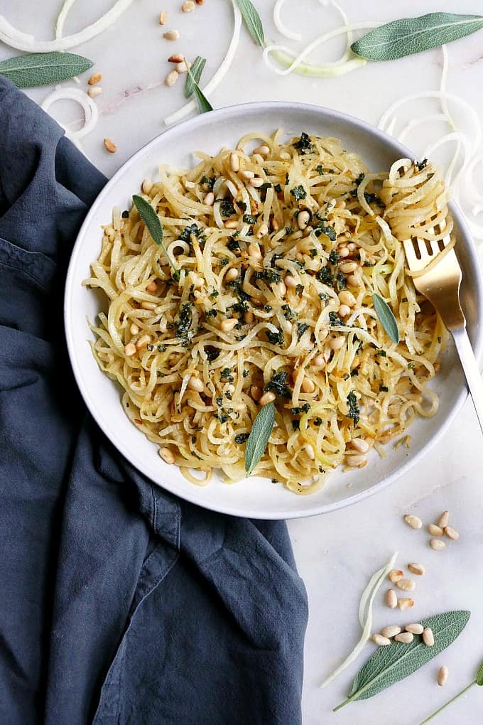 kohlrabi noodles and pine nuts in a bowl