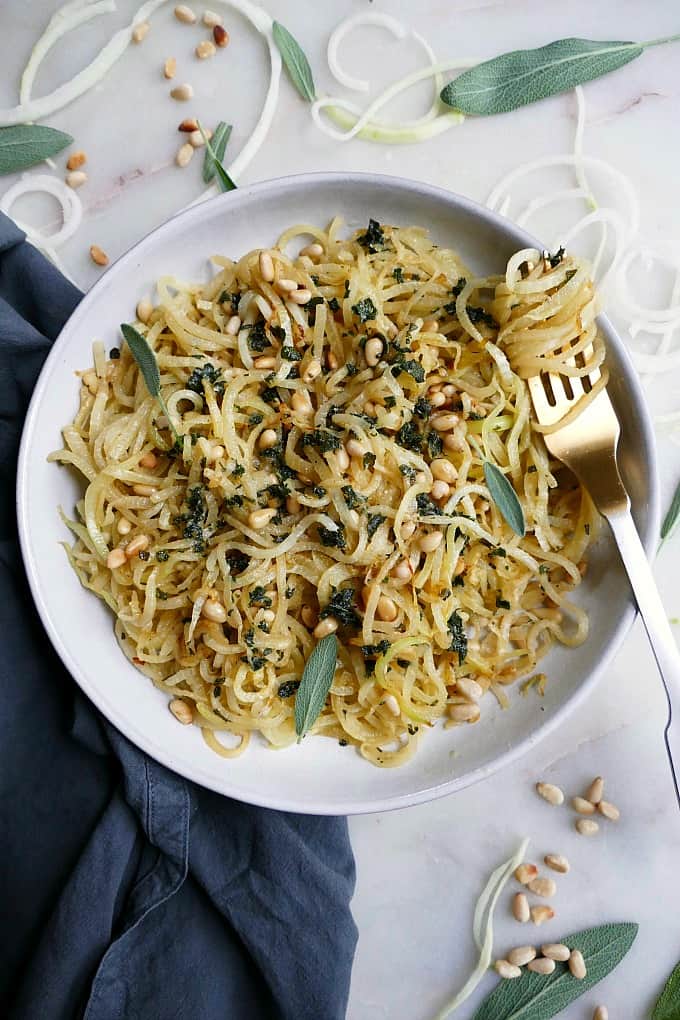 kohlrabi noodles and pine nuts in a bowl