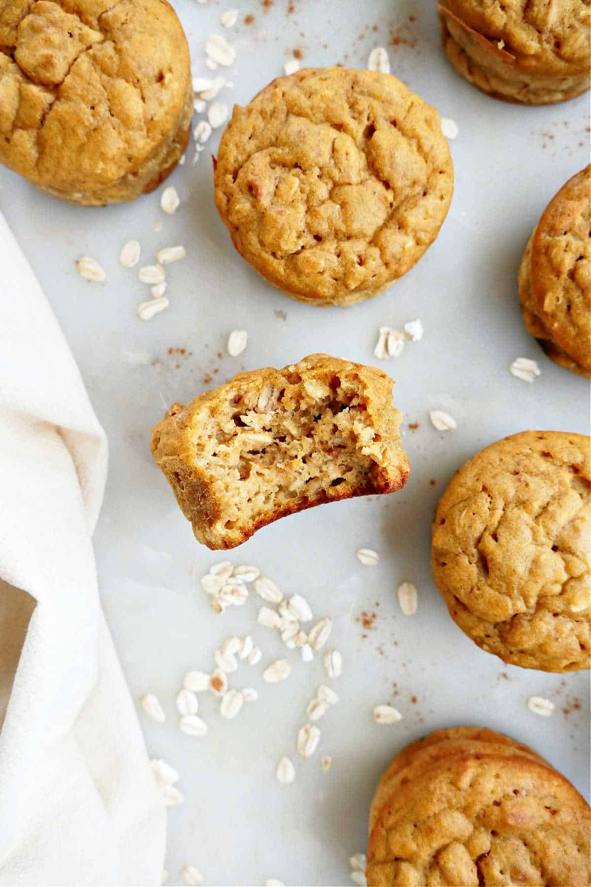 close up of butternut squash muffins on a plate with oats and cinnamon 