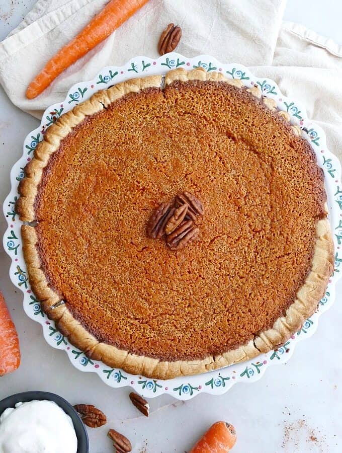 close up of homemade carrot pie in a baking dish on a counter