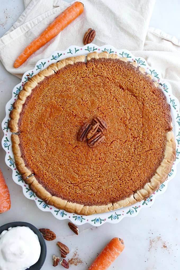 close up of homemade carrot pie in a baking dish on a counter