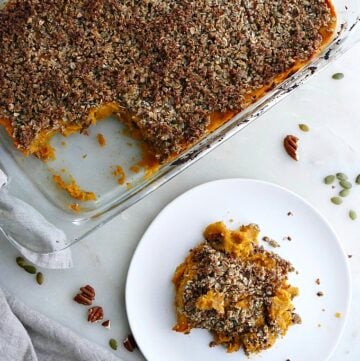 dish with gluten free sweet potato casserole next to a plate with a serving of it