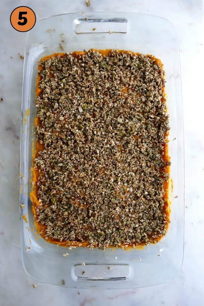 sweet potato casserole before it goes in the oven in a glass 9x13 dish
