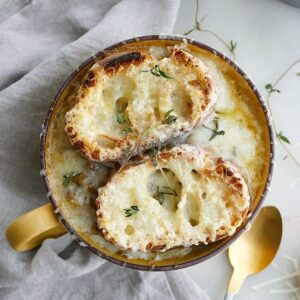 vegetarian french onion soup with lentils with gruyere toasties on top