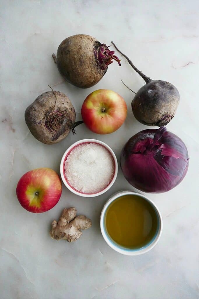 beets, apples, red onion, ginger, sugar, and vinegar on a counter