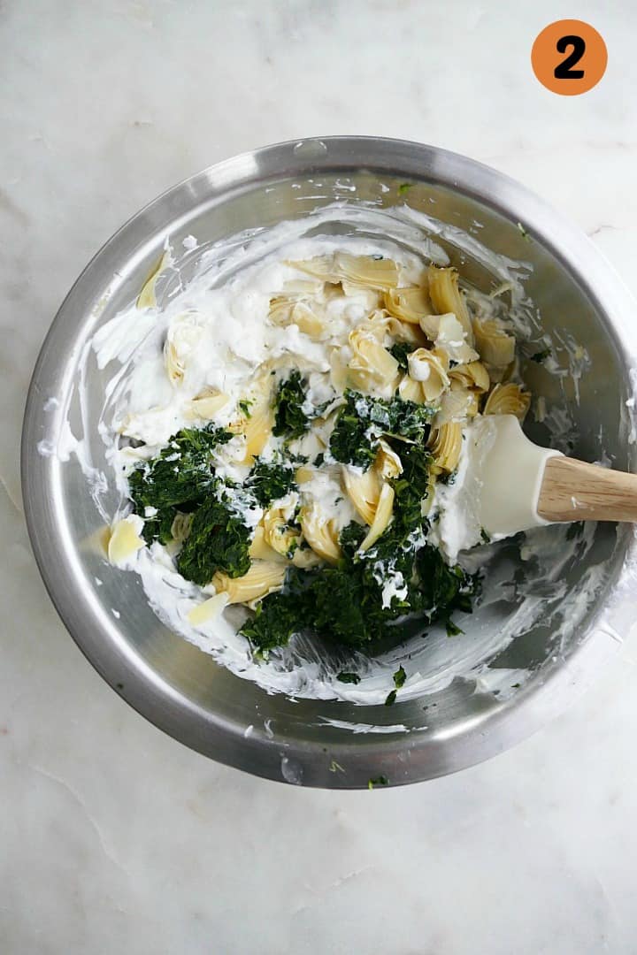 ingredients for lighter spinach artichoke dip in a mixing bowl