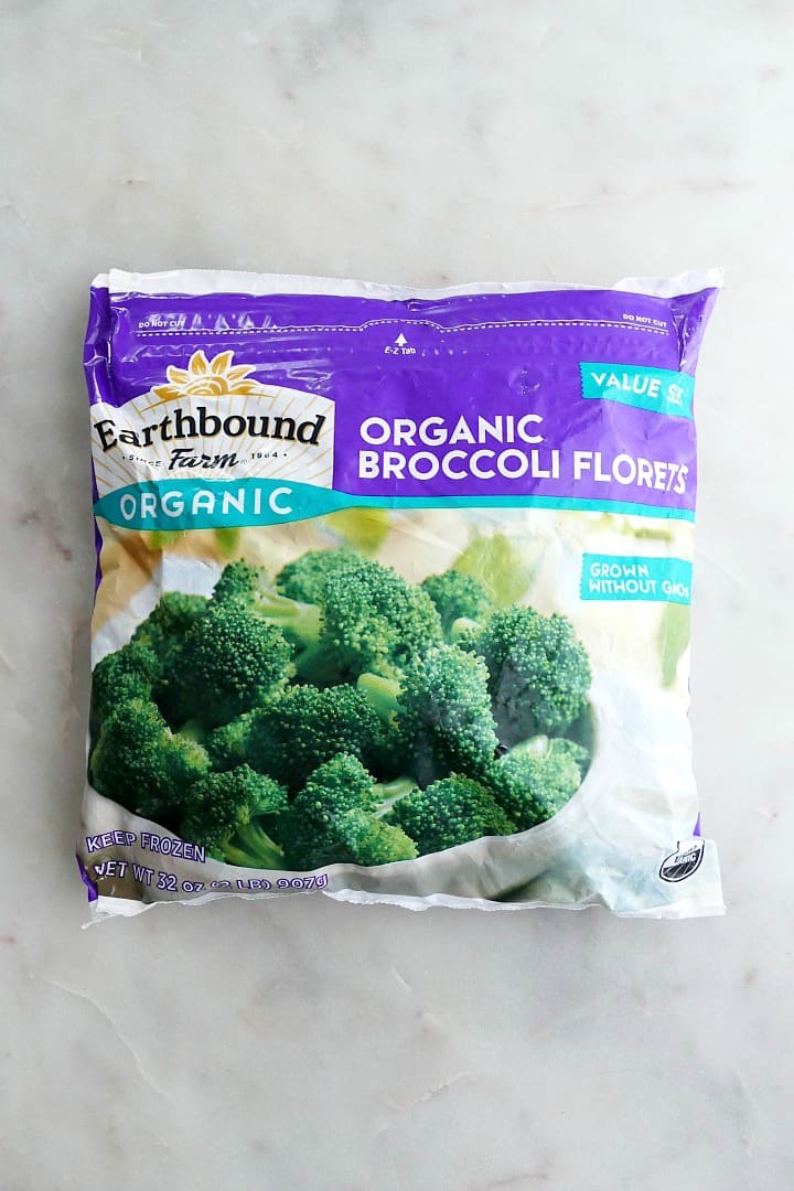bag of earthbound organic frozen broccoli florets on a white counter