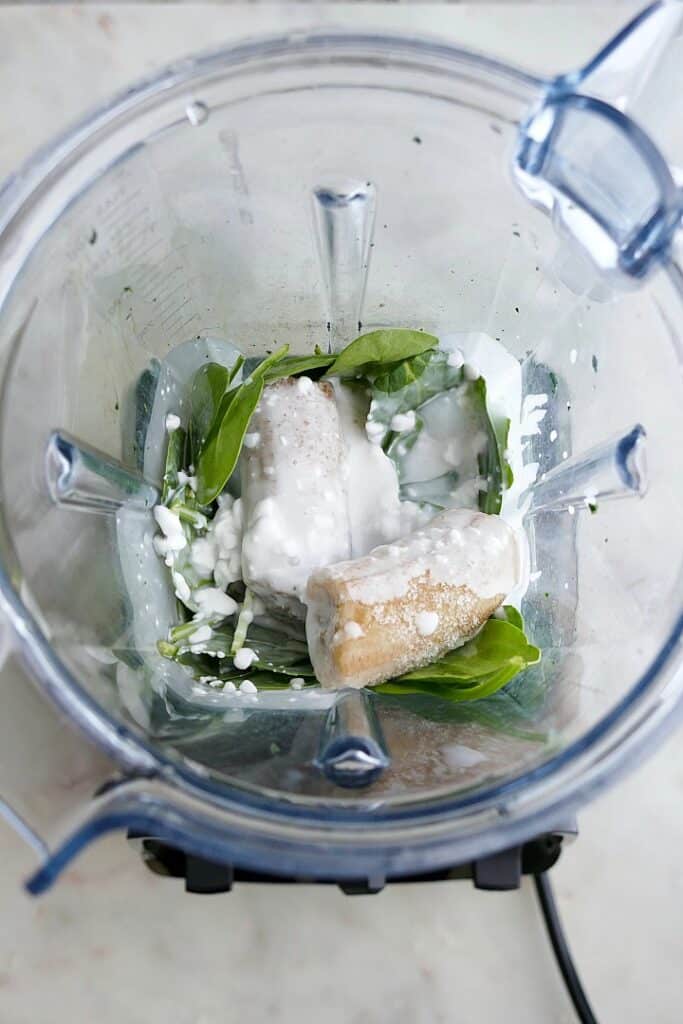 ingredients for a green smoothie in a vitamix blender