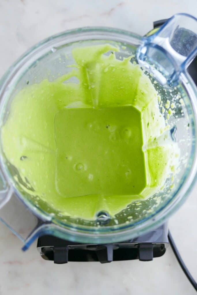 green mint banana smoothie blended in a vitamix blender