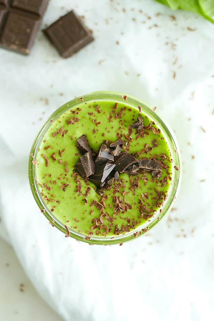 overhead shot of a mint banana smoothie with chocolate shavings