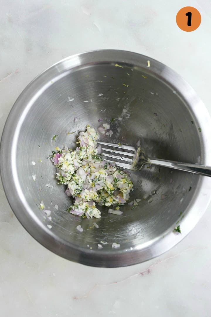 butter, lemon zest, shallots, and fresh dill in a silver mixing bowl on a counter