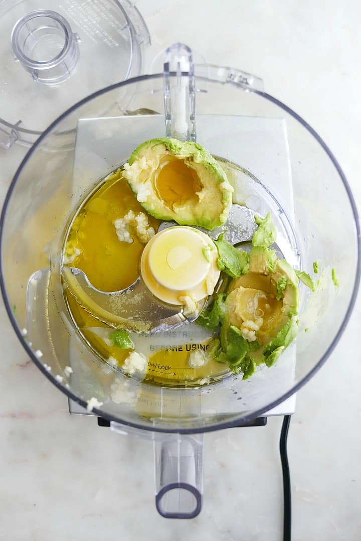 avocado flesh, olive oil, garlic, salt, and lemon juice in a food processor