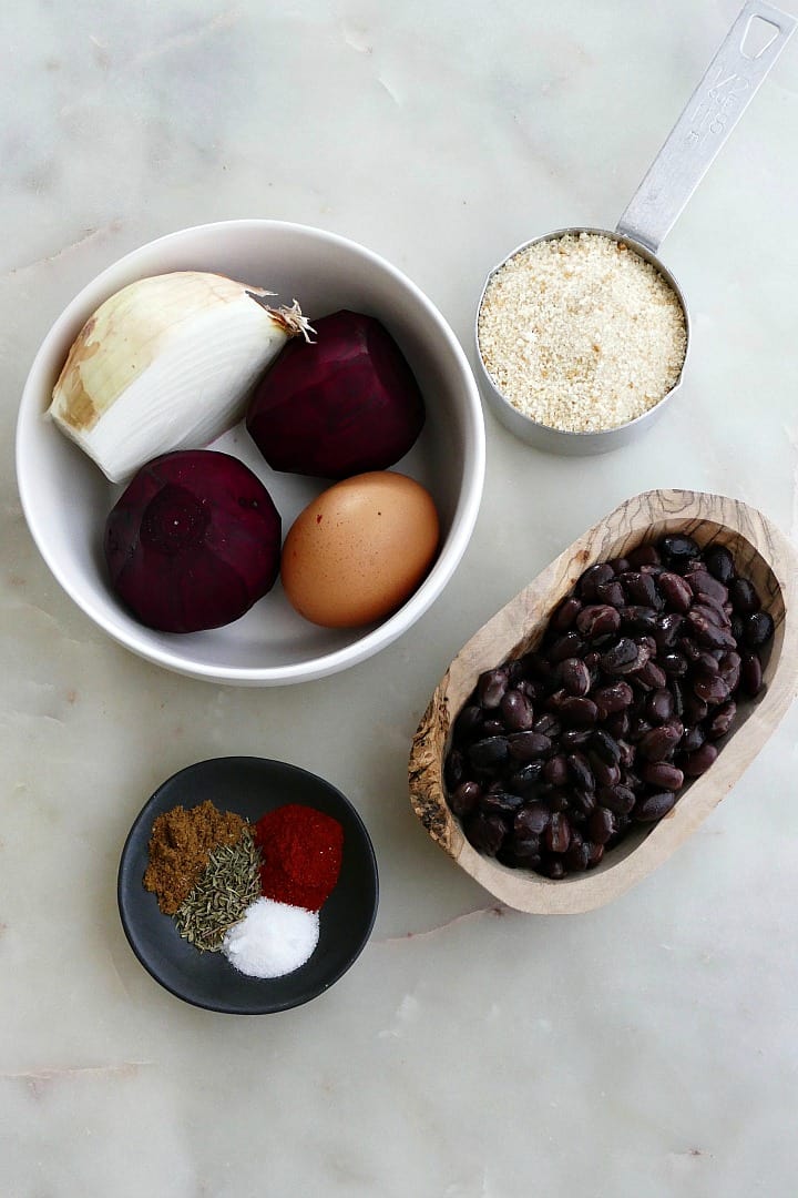 bowls with ingredients for beet burgers next to each other on a counter