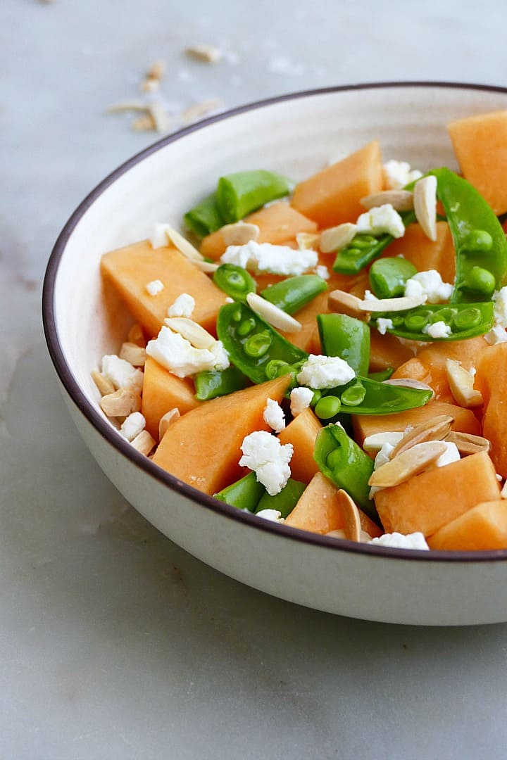 side view of finished recipe topped with goat cheese and slivered almonds