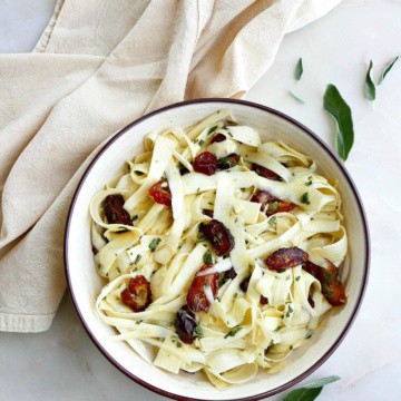 raw parsnip salad with dates and sage in a serving bowl on a counter